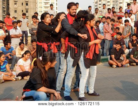 HYDERABAD,INDIA-MARCH 27:Nishumbita theatre group perform street play theme of Driving safe on road during raahgiri open road event on March 27,2016 in Hyderabad,India