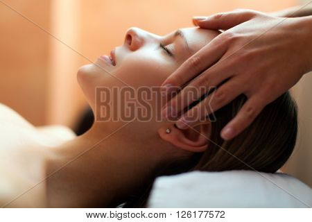 Beautiful woman having an head massage