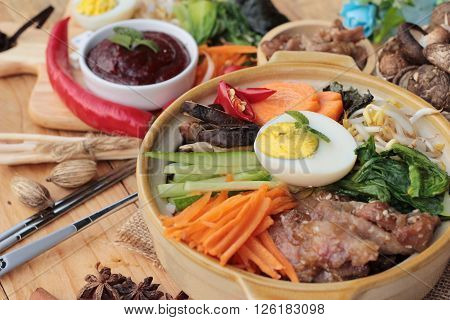 Bibimbap korean food is delicious placed on wood background