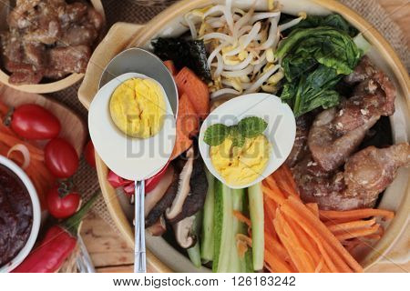 Bibimbap korean food is delicious placed on wood background
** Note: Visible grain at 100%, best at smaller sizes