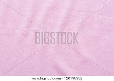 Close up of beautiful wrinkle pink fabric texture.