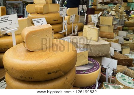 Amsterdam, Holland, April 9, 2016,  Variety of cheese for sale at the Noorder market  