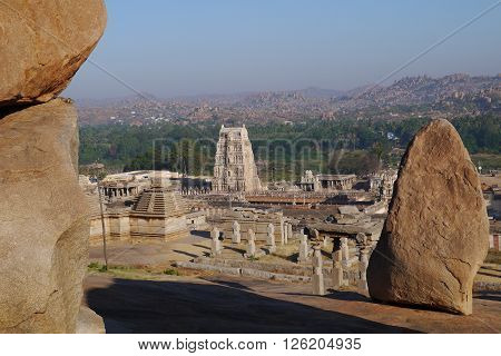 Stone boulders of Hampi in Kartanak's staff in India