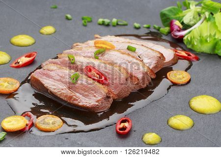 Pekin Duck With Vegetables Over Black Background