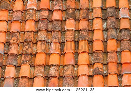 Terracote tiles on the roof, arcitectural background.