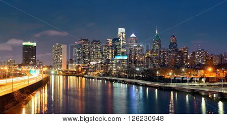 Philadelphia skyline at night with urban architecture.