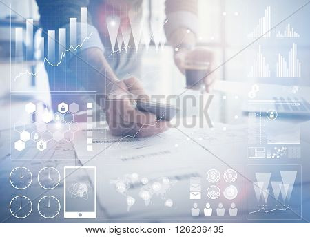 Business concept photo.Businessman working new startup project modern office.Holding contemporary smartphone hands. Worldwide connection technology, stock exchanges graphics interface.