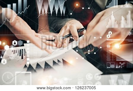 Businessmans crew working banking investment project modern office.Man holding pen for sign documents. Worldwide connection technology icons, stock exchanges graphics interface.