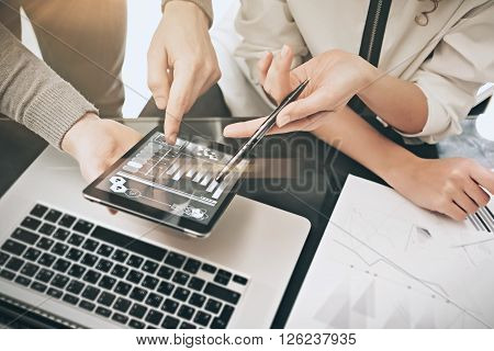 Investment department meeting process.Photo man showing reports modern tablet screen.Statistics graphics screen.Private banker manager holding pen for signs documents. New business project startup