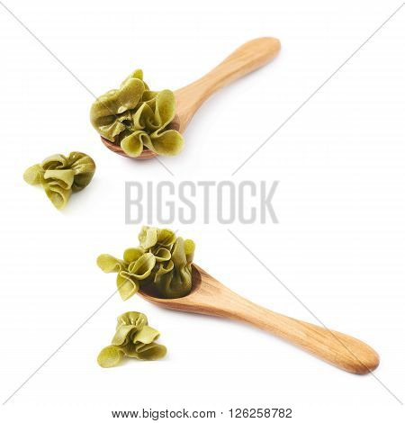 Wooden spoon full of sacchettoni stuffed pasta isolated over the white background, set of two different foreshortenings