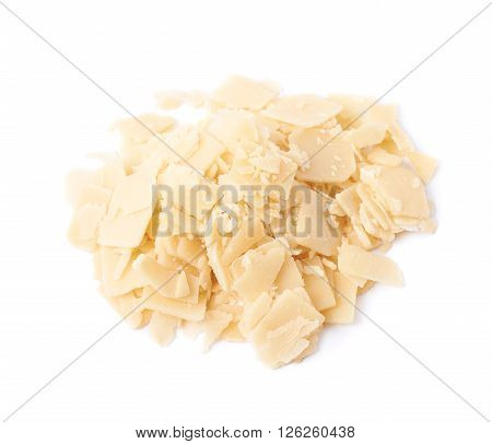 Pile of parmesan cheese flakes isolated over the white background