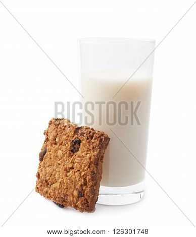 Glass of milk and quare oatmeal cookie composition isolated over the white background