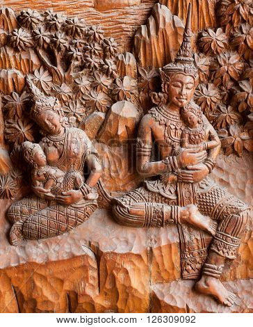 CHIANG MAI, THAILAND - FEB 21: Family with children in tradition art style of Thailand inside Wat Buppharam temple on February 21, 2016. The temple was established in 1497 by King Muang Kaew