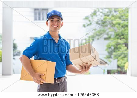 Delivery man holding a parcel box Sending