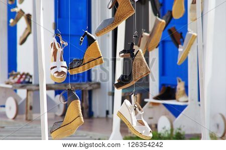 sandals for women Wedge and others hanging on the ropes