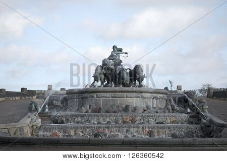 COPENHAGEN, DENMARK - NOVEMBER 03, 2014: View Gefion fountain, cloudy november evening. The landmark of Copenhagen, Denmark