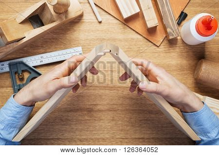 Woodworking workshop table top scene. Making of loose tenon joint.