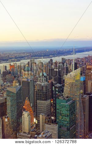 Aerial view from Observatory deck in the Empire State Building on Midtown district of Manhattan in New York. Hudson river is on the background.