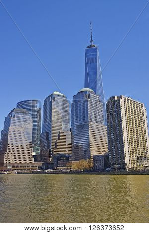 NEW YORK USA - APRIL 25 2015: View from Ferry on World Financial Center or Brookfield Place of Lower Manhattan New York USA. Hudson River. Tourists nearby