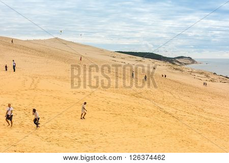 People Visiting The Highest Sand Dune Of Pyla In Europe