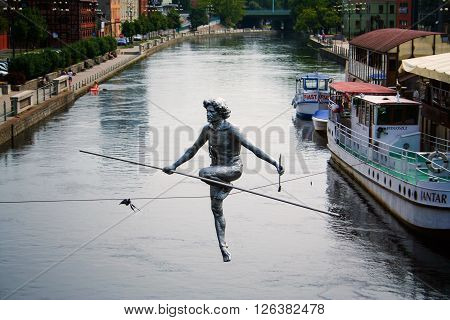 Bydgoszcz Poland - August 5 2012: Old town view with famous statue on the rope. Bydgoszcz is the the largest city in Kuyavia (Kujawy) region.