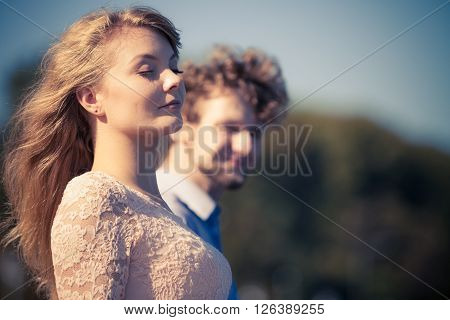 Happiness summer dating concept. Man and woman spending time together having fun outdoor.