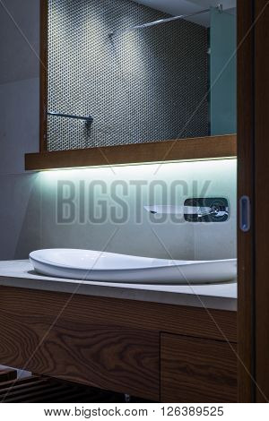 Lavatory And Mirror In Modern Bathroom Interior