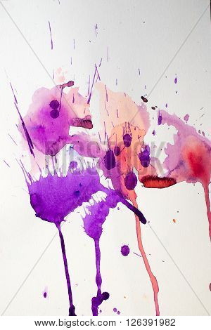 colorful watercolor stains and streaks on a white background