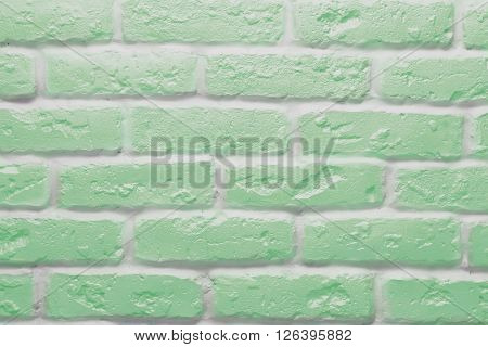 Green brick wall texture or background, abstract