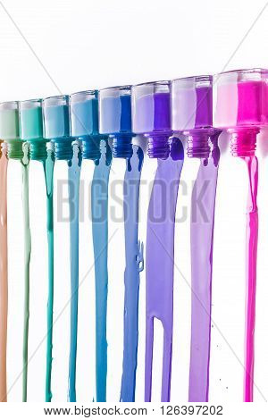rainbow of nail polish isolated on a white background