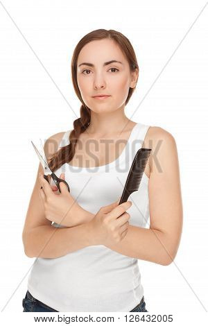 Beautiful woman with comb and sissors smiling isolated on white (focus on woman)