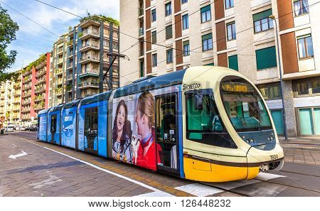 Milan, Italy - May 8, 2014: AnsaldoBreda Sirio tram in the city centre of Milan. In operation since 1881, the tram network is now 170 kilometers long