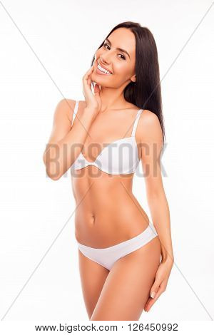 Happy Slim Woman In White Lingerie Touching Her Hip