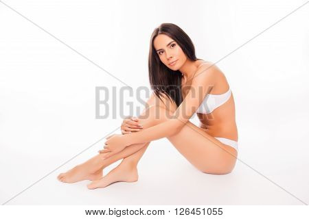 Pretty Healthy Slim Woman Sitting On White Background