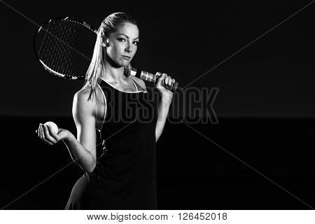 Portrait Of Young Beautiful Woman Playing Tennis