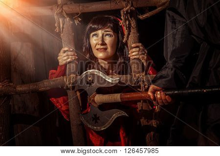Beautiful Witch In Red Dress In The Dungeon Is Looking On The Sun Ray.
