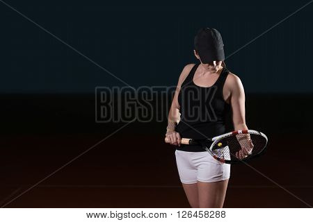 Woman In Sportswear Serves Tennis Ball
