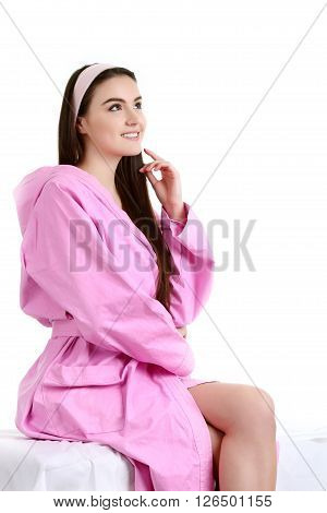 Young spa woman touching her face after beauty treatment