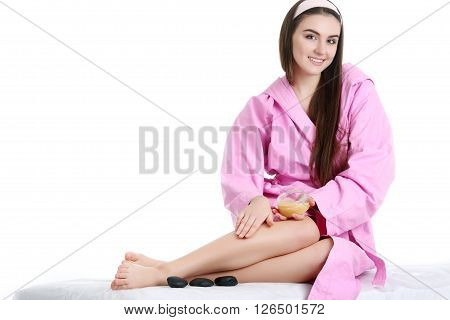 Young spa woman touching her face after beauty treatment