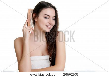 Young spa woman touching her face after beauty treatment