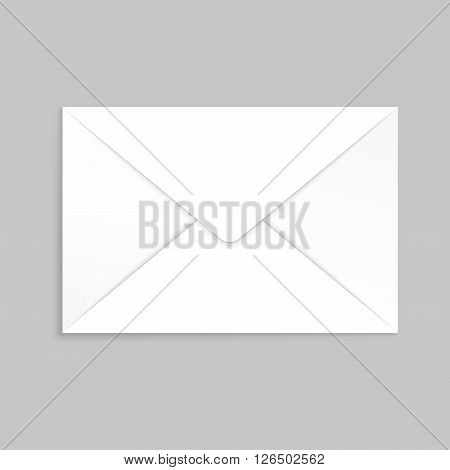 White envelope for identy design. Blank envelope isolated on light gray background with clipping path