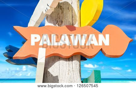Palawan signpost with beach background