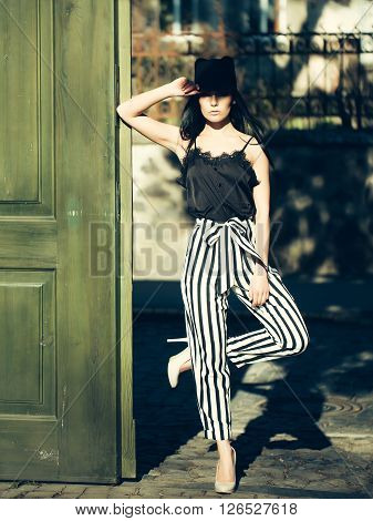 Woman Near Wooden Door