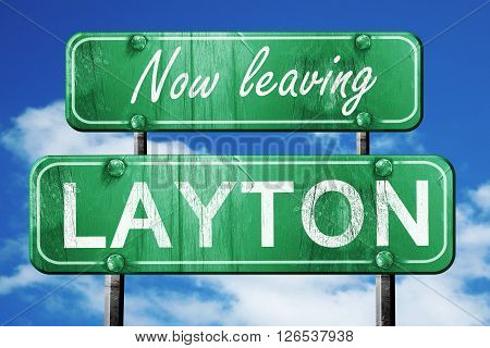 Now leaving layton road sign with blue sky