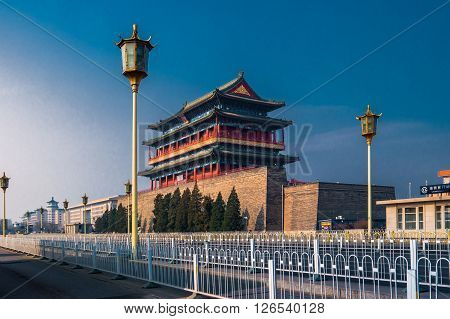 Beijing, China at the Zhengyangmen Gatehouse in Tiananmen Square. Beautiful historical building at sunset.