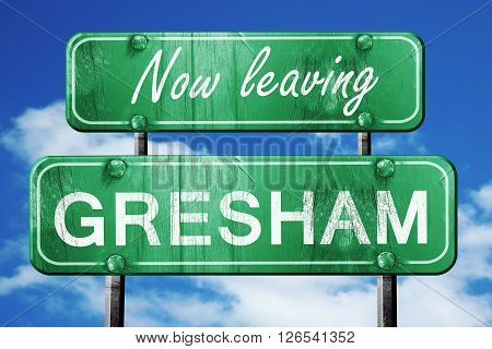 Now leaving gresham road sign with blue sky