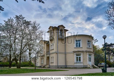 Warsaw, Poland - April 14, 2016: The library building Library for Children and Youth in Veterans Park at spring, Stare Wlochy