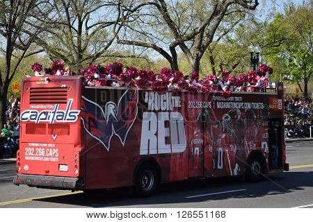 WASHINGTON, DC - APR 16: Double decker bus at the 2016 National Cherry Blossom Parade in Washington DC, as seen on April 16, 2016. Thousands of visitors gathered to attend this annual event.