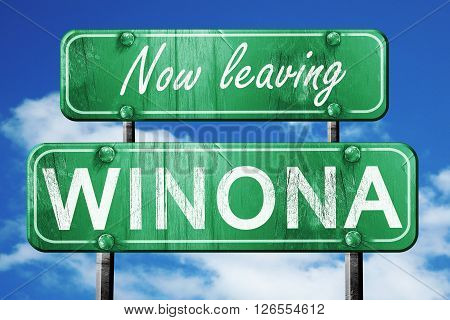 Now leaving winona road sign with blue sky