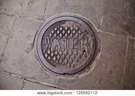 Water manhole cover in the French Quarter New Orleans Louisiana.